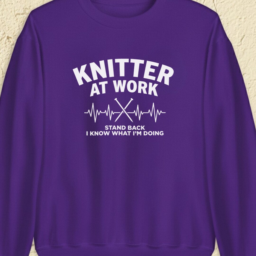 Knitter At Work Purple Sweatshirt.jpg