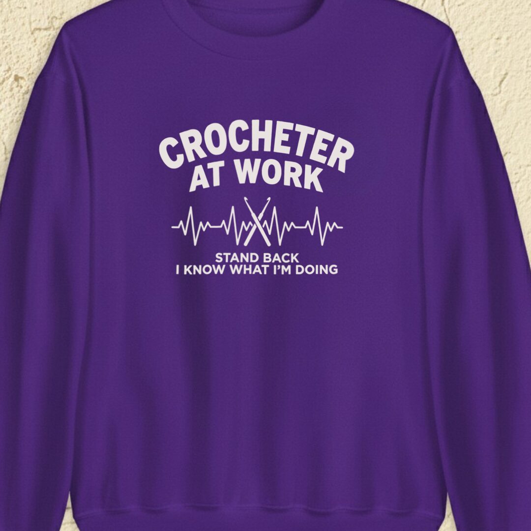 Crocheter At Work Purple Sweatshirt.jpg