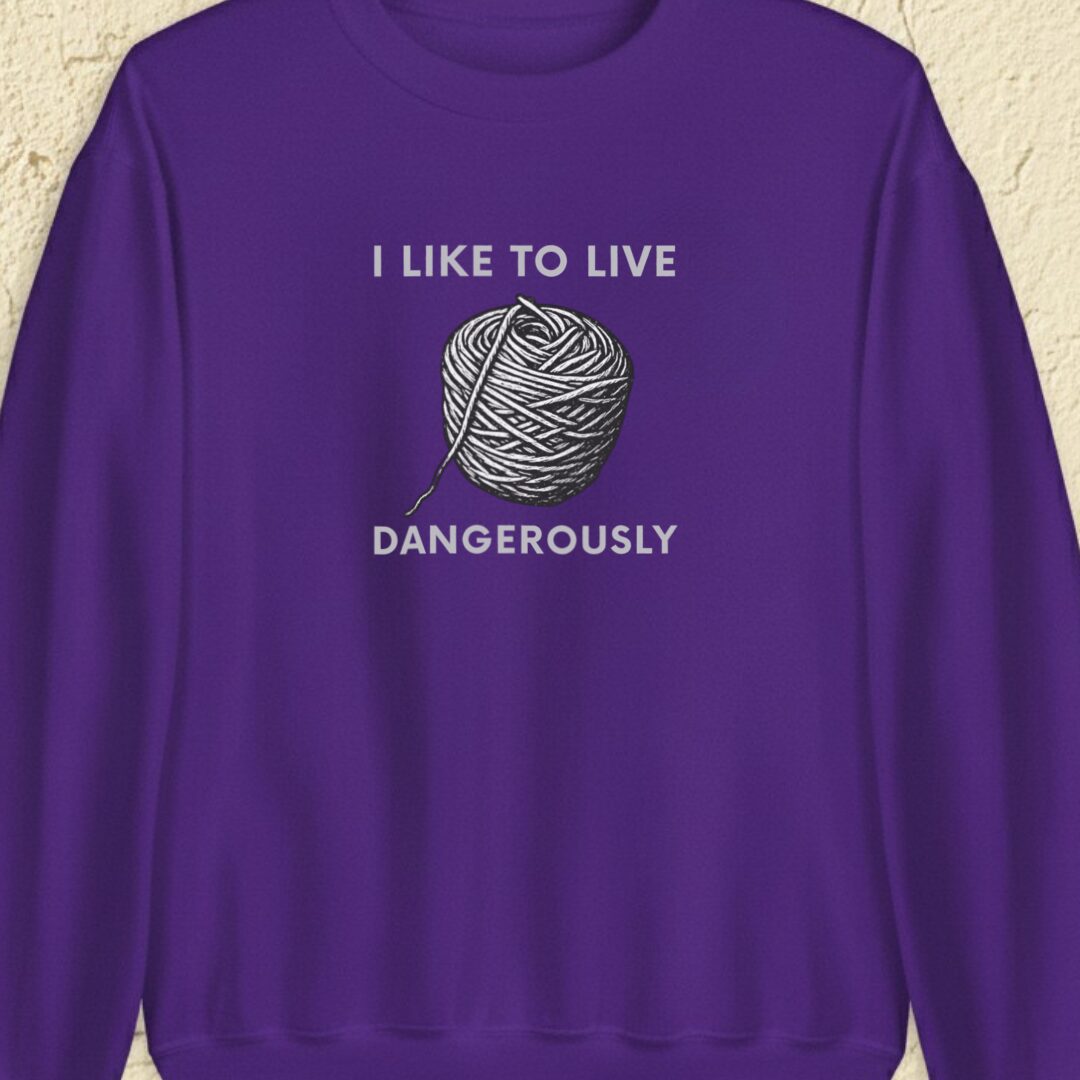 Live Dangerously Purple Sweatshirt.jpg