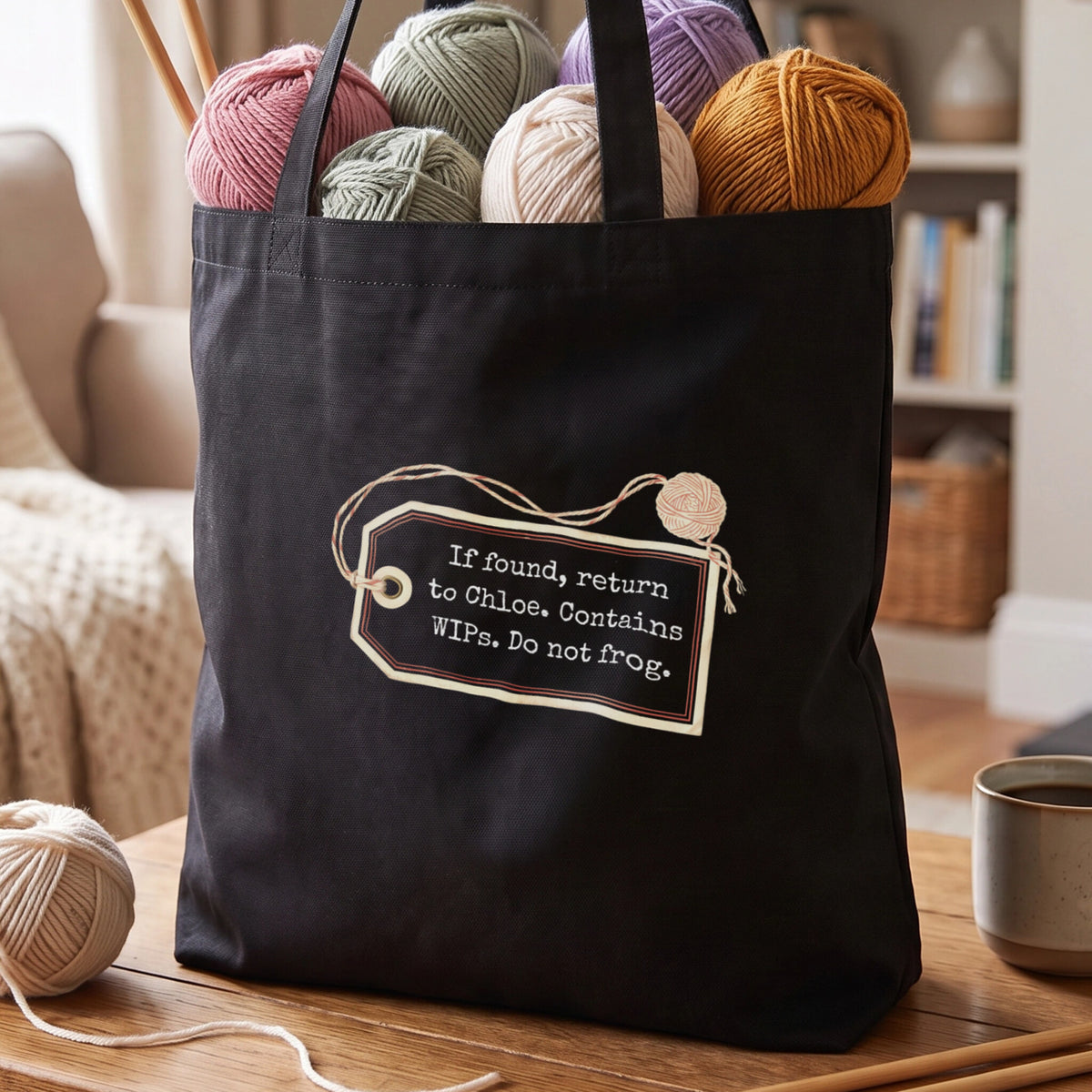 Black tote bag with the luggage tag design and the name Chloe