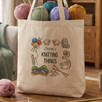 Natural tote bag reading Susan's Knitting Things, framed by illustrated yarn, needles and sheep