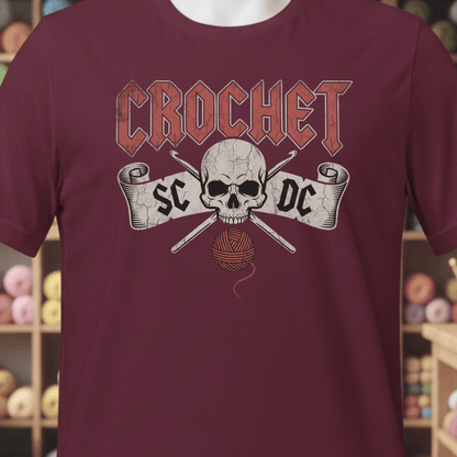 Maroon crochet-themed t-shirt with skull and yarn graphic for yarn enthusiasts.