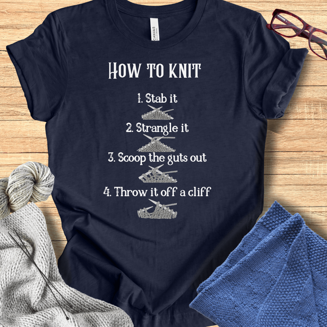Navy blue cotton t-shirt with quirky 'How to Knit' text graphic and humorous instructions.