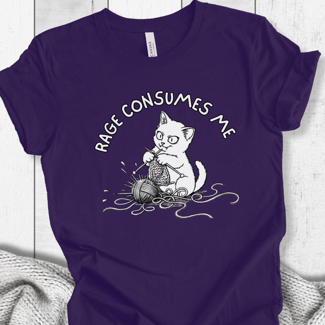 Funny purple t-shirt featuring a cat knitting with the phrase 'RAGE CONSUMES ME' in bold lettering.