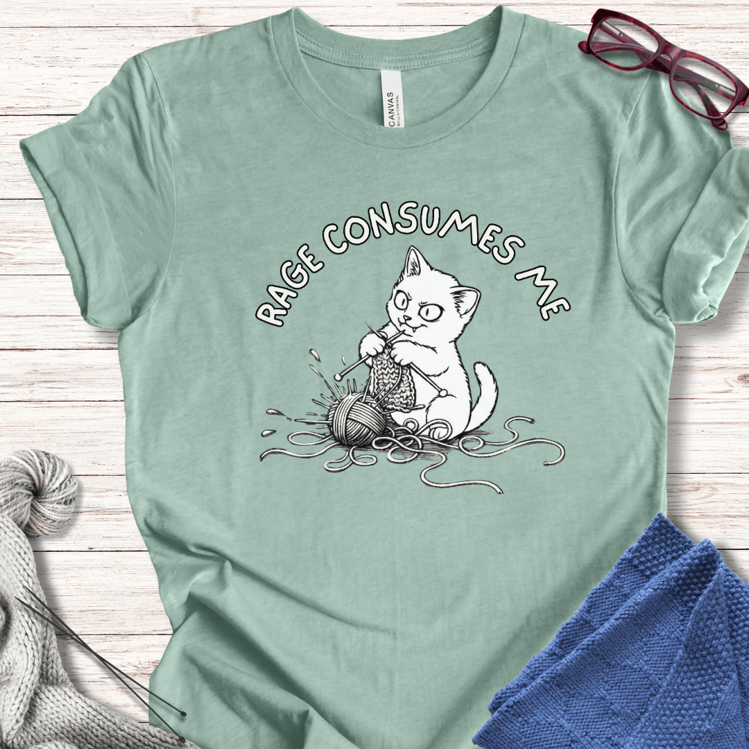 Light green cotton t-shirt with a cat graphic and 'RAGE CONSUMES ME' text, ideal for cat lovers.